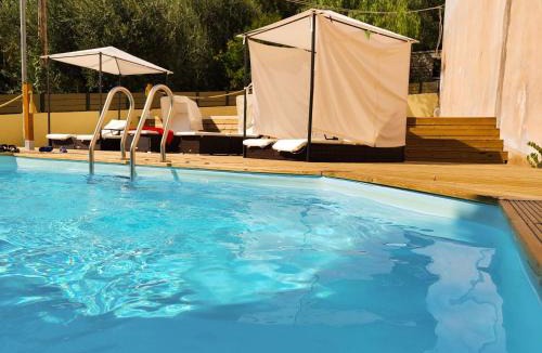 Kalami House | Holiday Home Gemütliches Olympia Apartment mit Pool by Interhome