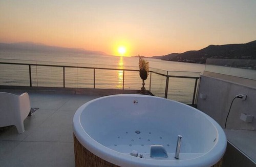Loutraki Apartment | Stylish Rooftop Retreat Hot Tub Loutraki Beach