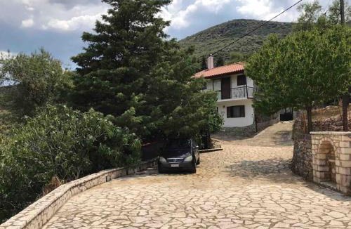 Andritsaina House | Theisoa.Old Little house in the garden . Andritsaina.