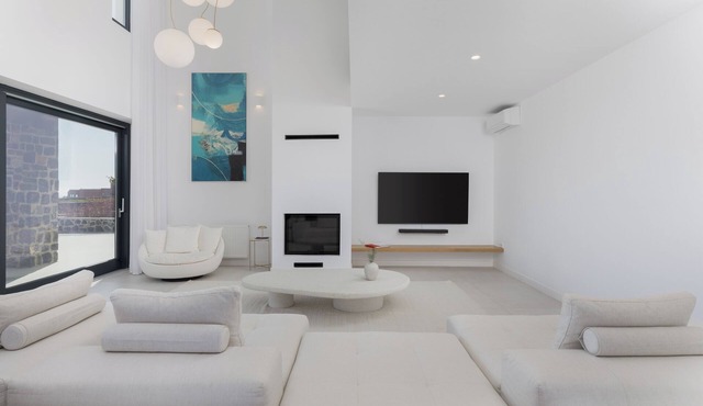 A luxurious Santorini villa set in a vineyard, with pool and stunning views. in Fira