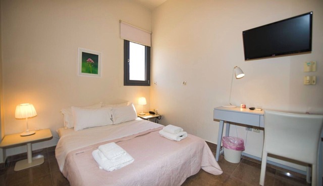 Sea-view apartment in private villa with pool, gardens and modern comfort in Egina