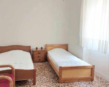 Single Bed in Dormitory Room