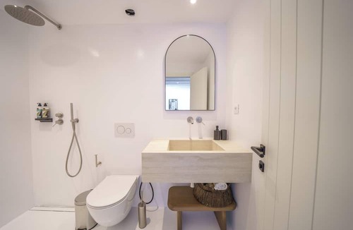 Paraga Villa | Natural stone craftsmanship with a private cascade pool in Mykonos