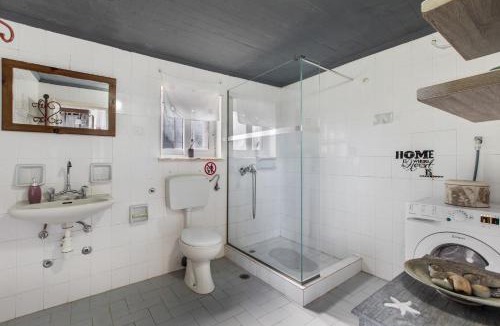Galatas House | Stone house among trees